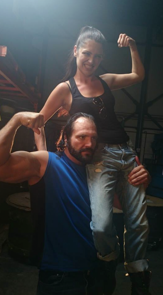 Devon holds Elysia on his shoulder